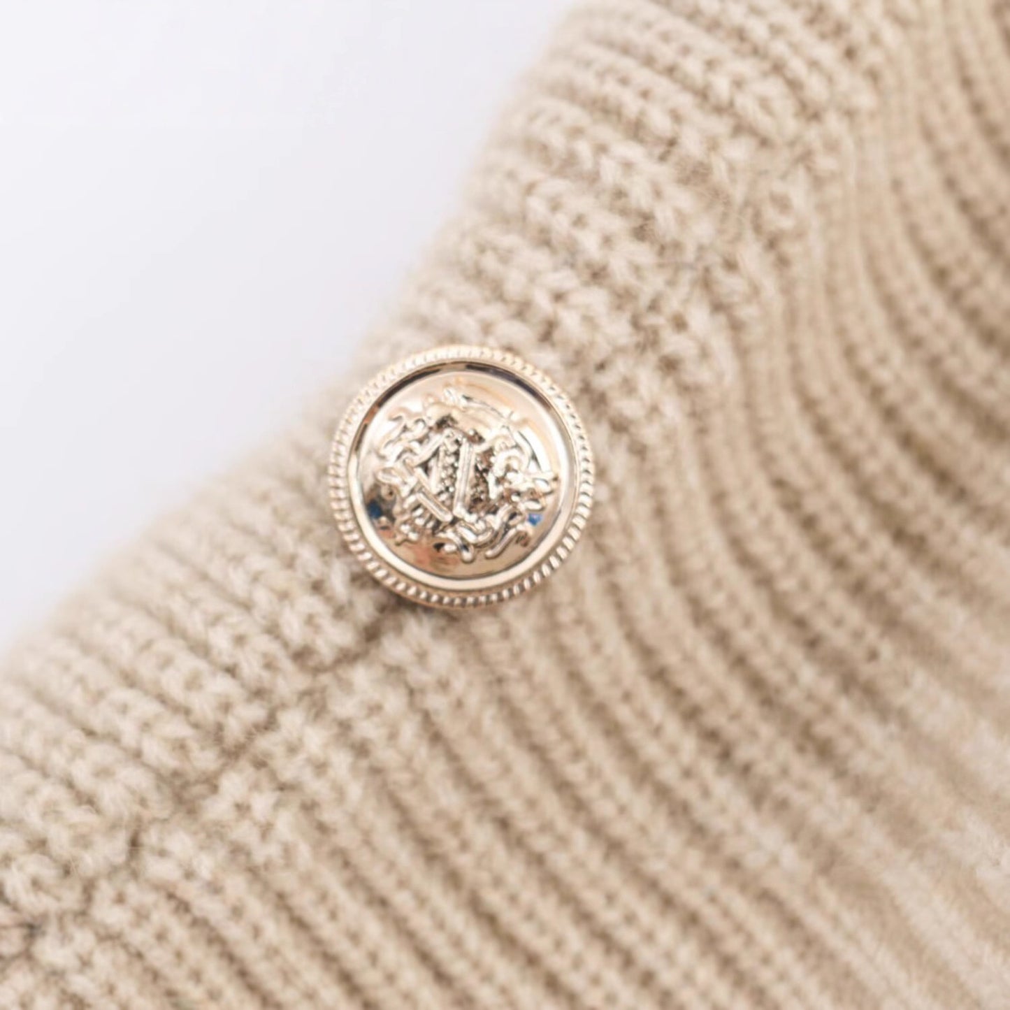 Splicing bat sleeve shoulder buckle irregular knit sweater top for women